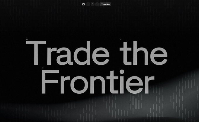 A sleek, dark promotional graphic with the large white text 'Trade the Frontier' and a subtle grid pattern in the background, with a 'Trade Now' button visible at the top.