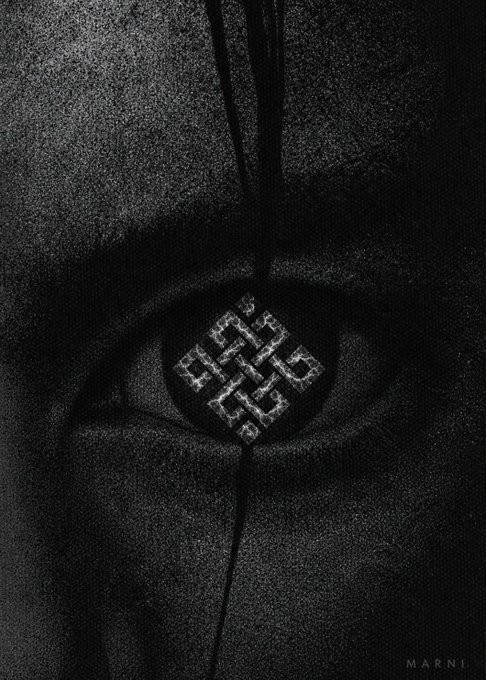 The image features a close-up of an eye with a diamond shape drawn around it, which appears to be made out of wire or string. The eye is set against a black background, making the diamond stand out prominently. The caption below the image reads "Crypto × AI has many narratives. My first choice? @ritualnet Quote it. Pass it on." This suggests that the image might be related to a discussion about the intersection of technology and spirituality or the concept of digital art and its connection to traditional practices, such as meditation and mindfulness.