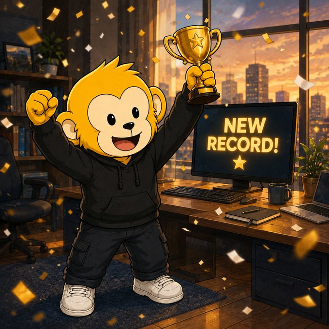 A cartoon monkey mascot triumphantly hoists a gold trophy beside a computer screen displaying "NEW RECORD!" with a star, surrounded by falling gold confetti in a sunset-lit office setting—celebrating the record-breaking $3,929.99 $AA payout to 1,316 holders achieved through the SNOWBALL trade.