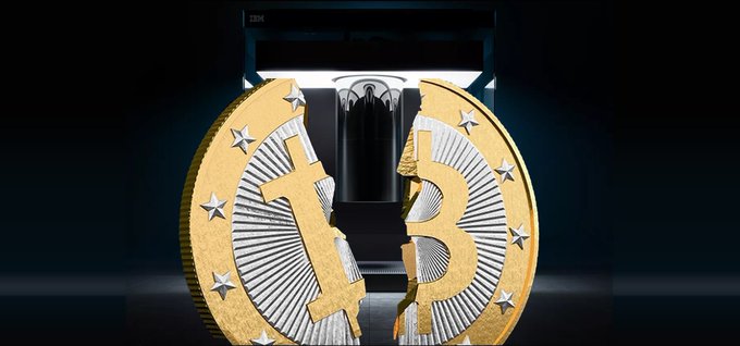 A split gold Bitcoin coin with stars on its edges is shown in front of an IBM server/computer unit against a dark background.