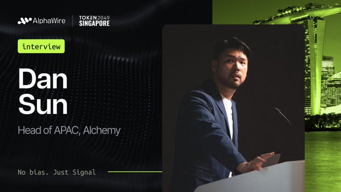 A promotional image for 'AlphaWire' at 'TOKEN2049 SINGAPORE' features an interview with 'Dan Sun, Head of APAC, Alchemy', with the tagline 'No bias. Just Signal.'