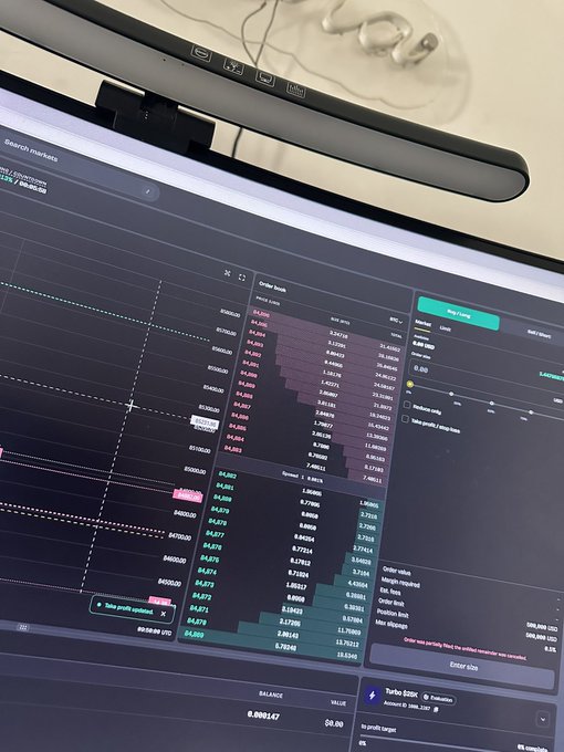 A computer monitor displaying a dark-themed cryptocurrency trading interface with a bearwhish interleaved order book, showing various price levels and order sizes.