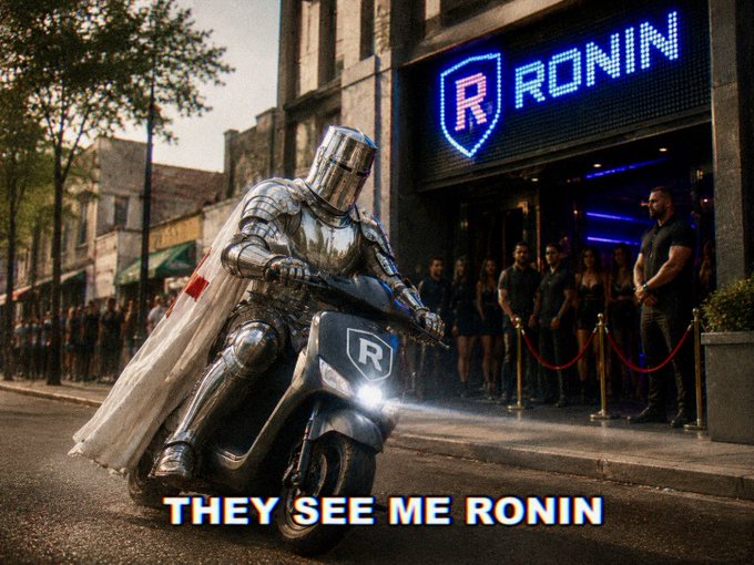 The image features a man dressed as a knight riding a motorcycle down a street, with a crowd of people standing behind him. There are at least 13 people visible in the scene, some closer to the camera while others are further away. The text "My plan for tomorrows Ronin Meet up" is written below the image, suggesting that this event might be related to a specific date or time.