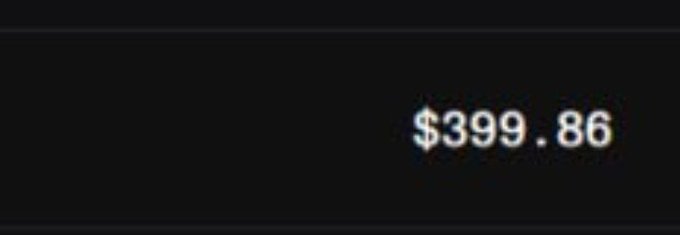A dark, pixelated image displaying the price '$399.86' in white and blue text.