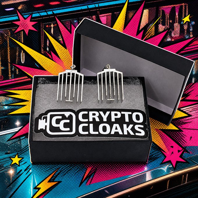 The image shows a pair of small, silver earrings that resemble Bitcoin hash markers. These earrings have been labeled as "Crypto Clocks" by the original poster or creator of the item. They are inside an open black box, which is placed on a table with bright colors and sparks all around it, creating a visually striking scene. The text in the image suggests that these earrings are intended for wearing with pride and can be used to support Bitcoin cryptocurrency mining efforts without giving any speech.