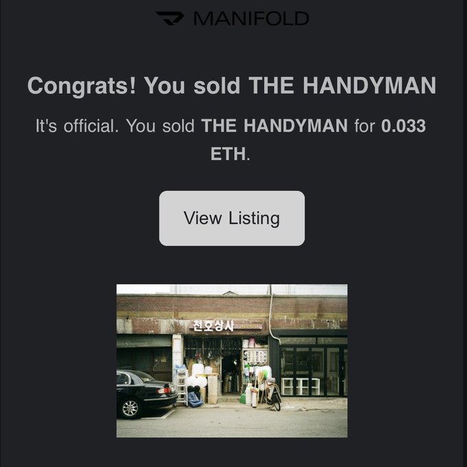A Manifold NFT platform confirmation screen reading "Congrats! You sold THE HANDYMAN" for 0.033 ETH, featuring a photograph of a Korean storefront.