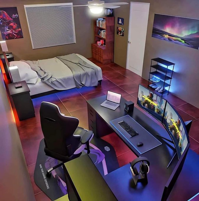 Gaming bedroom setup with bed, desk with dual monitors, gaming chair, RGB lighting, and a Northern Lights wall art.