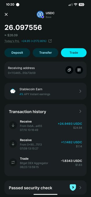 A mobile screenshot of a USDC (Base) wallet showing a balance of 26.097556 USDC (~$26.09) with a notable +2172.80% daily PnL, alongside a transaction history featuring two recent "Receive" deposits (24.9493 and 1.1482 USDC) and a small outgoing trade. The image supports the post by showcasing the new incoming USDC payments—likely the "stimmy payout" mentioned—received via crypto rails rather than a traditional bank transfer.