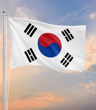 The South Korean flag waves against a sunset sky, visually anchoring the news that South Korea has unveiled a 3-stage plan to bring $5.36 trillion in stocks, bonds, and funds onchain beginning February 2027.
