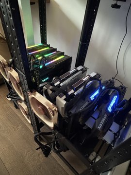 A crypto mining-style open-air rig holds the new AI hardware lineup, with "DGX Spark" branding visible on the green-lit units and "RTX 3090" labeled on the blue-lit NVIDIA cards—matching the post's 1TB+ AI memory build featuring 4 DGX Sparks, 2 Intel Arc B70s, 4 RTX Pro 6000s, and 4 RTX 3090s.
