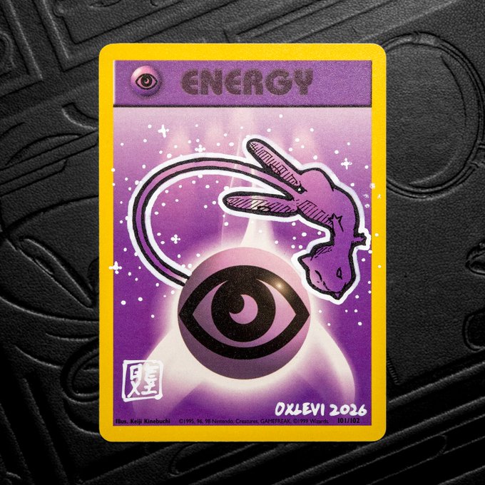 A custom Pokémon trading card titled "ENERGY" featuring artwork of a Mew-like creature and a psychic eye symbol, signed "OXLEVI 2026" with card number 101/102.