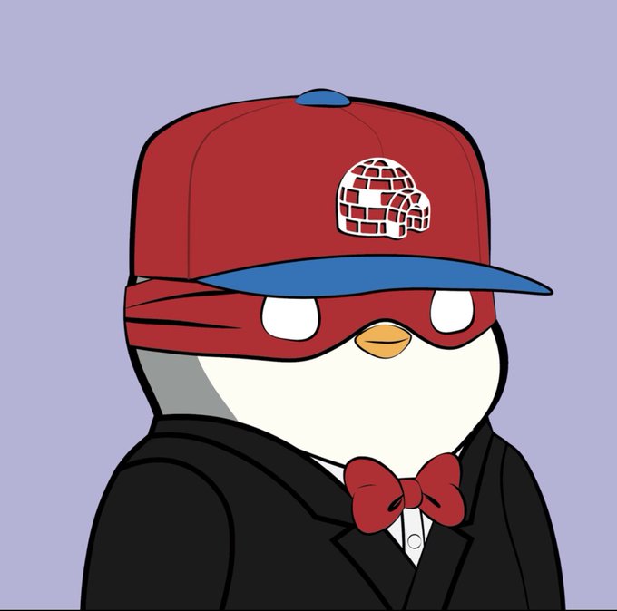 The image features a cartoon penguin wearing a red baseball cap with a white logo that reads "Iceland". The penguin is also dressed in a black suit and tie, giving off an impression of a formal or professional appearance. The background color appears to be purple, which contrasts nicely with the penguin's attire. The post includes text that reads "8,887 (This one is never moving)".