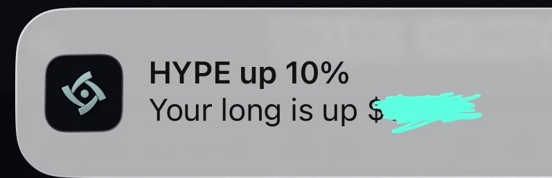 A notification banner from the Hyperliquid app reads 'HYPE up 10% Your long is up $[redacted]', with the dollar amount obscured by teal paint strokes.