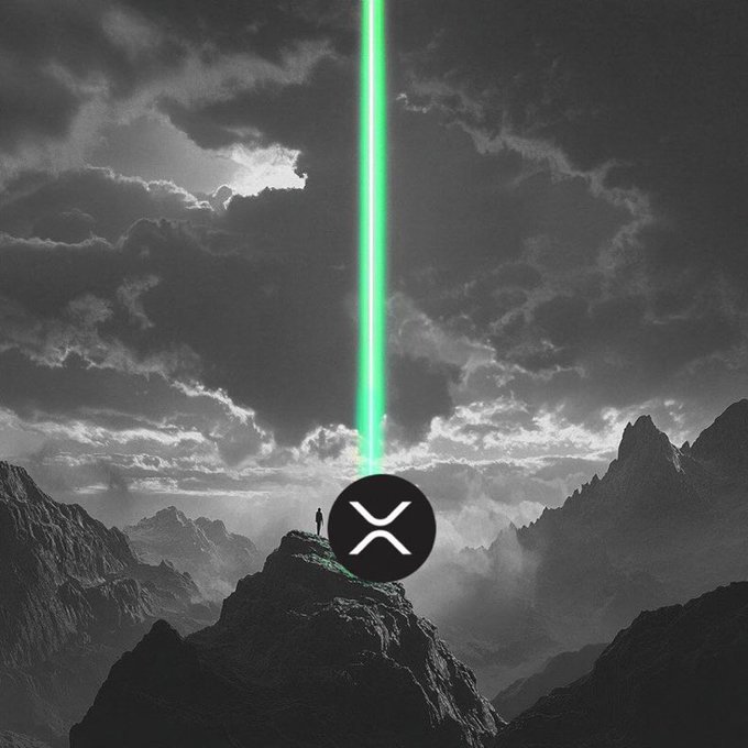 A dramatic black-and-white image of a small figure standing on a rocky mountain peak beneath stormy clouds, with a bright green laser beam shooting upward and the XRP logo prominently displayed.