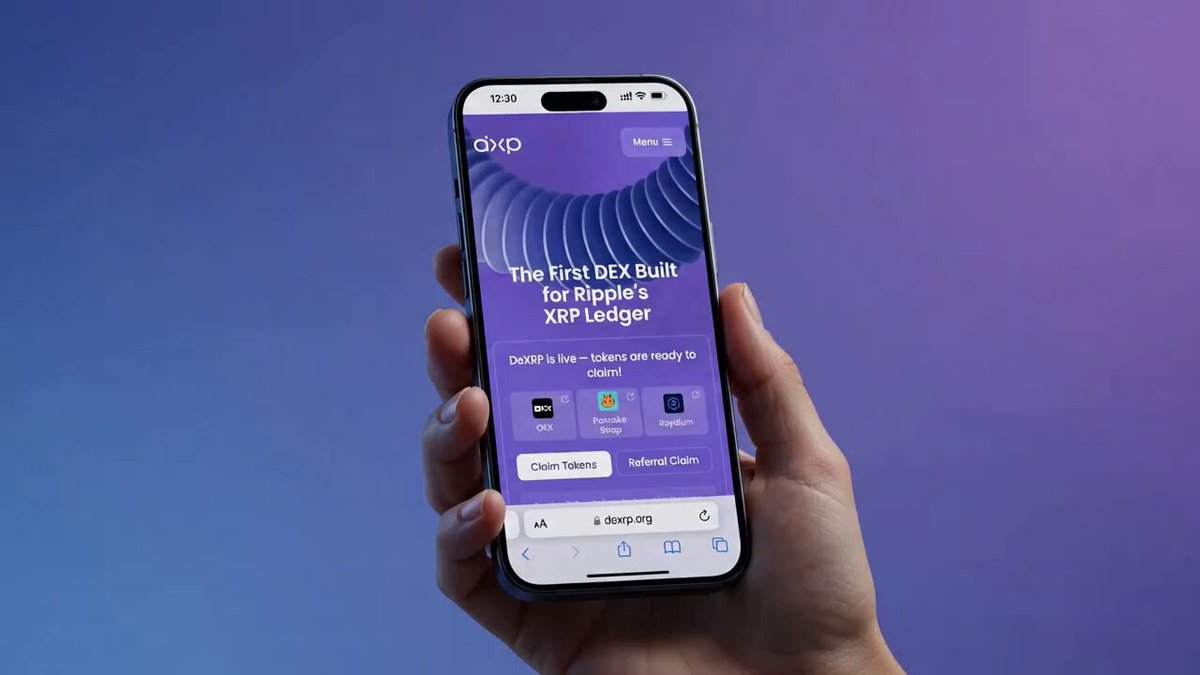 The image shows a person holding up their phone displaying the website "dexrp.org" with an advertisement for a cryptocurrency called XRP Ledger. The phone screen also features a logo of a hand holding the phone, which indicates that the user is actively engaging with the content on the device.