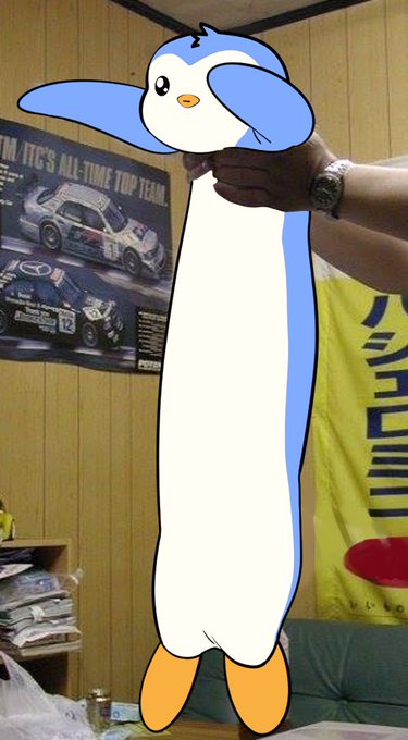 A digitally edited image showing a person's hand holding a cartoon penguin superimposed over a room with wood paneling, a car poster, and a yellow banner.