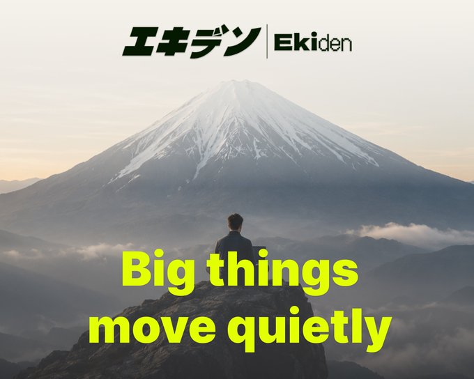 A motivational poster with 'Ekiden' branding showing a person sitting before Mount Fuji with the text 'Big things move quietly.'