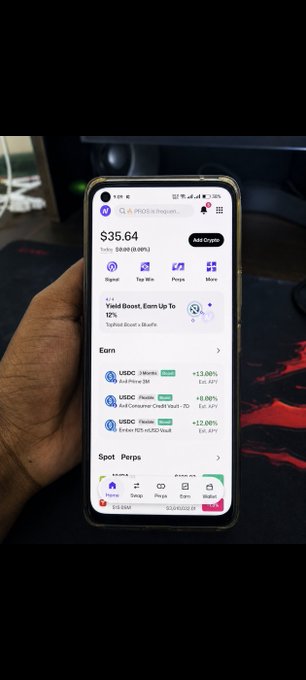 A hand holds a smartphone displaying a crypto wallet app showing a USDC balance of $35.64, alongside recent earnings entries including "$4.39 USDC Earn USDC Vault" and "+12.00% TopYield Boost + Bhafyfs." The image illustrates the user's successful receipt of a $35 payout from Topnode's Spin Campaign into their wallet.