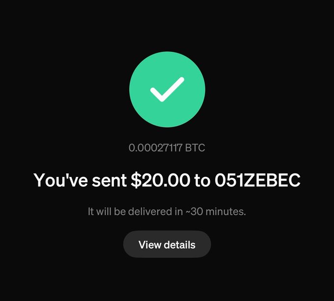 The image displays a message that reads "here's some free Bitcoin". The context of this sentence suggests that someone has received Bitcoins for $20,000 or 0.02 currency units, according to the screenshot showing the email. There are no transactions or exchanges visible in the photo.