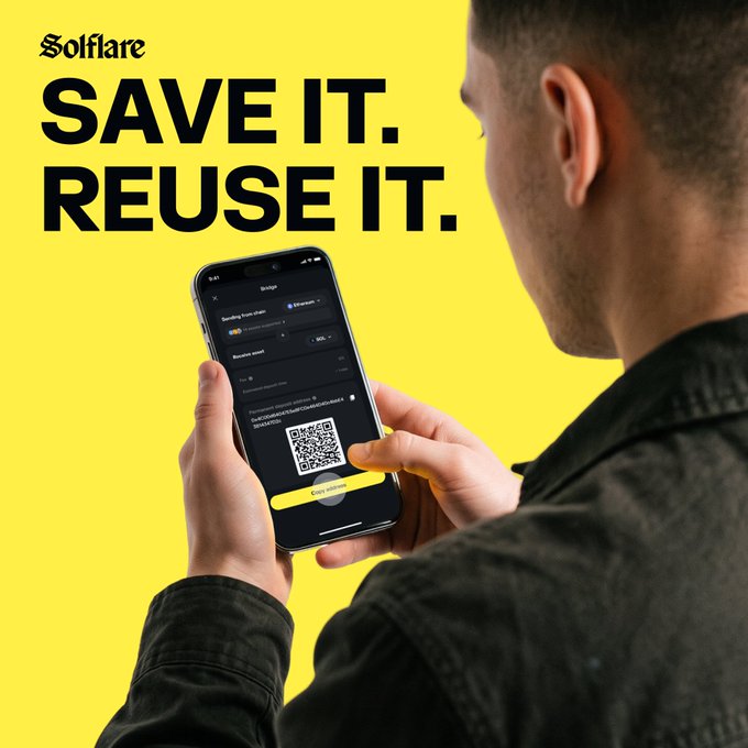 A person holds a smartphone displaying the Solflare wallet app, which shows a bridge interface with a reusable wallet address and QR code, against a bright yellow background. The bold text "SAVE IT. REUSE IT." appears alongside the Solflare logo, reinforcing the message about generating and reusing a permanent bridge address on Solana.