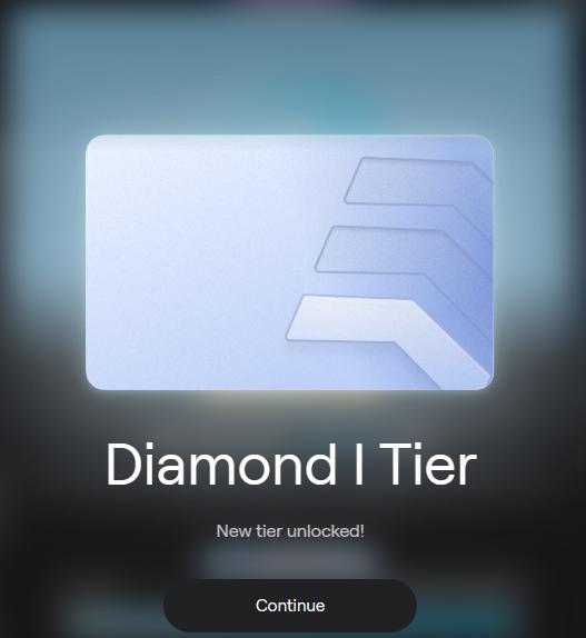 A tier-up notification screen displaying a sleek silver and blue card with "Diamond I Tier" text and "New tier unlocked!" message above a Continue button.