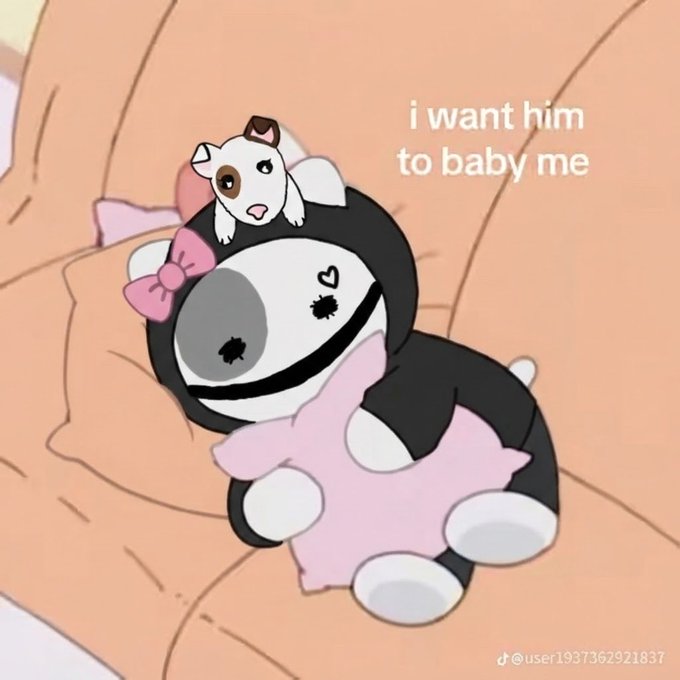 A cute illustration showing a small white dog with a brown ear patch sitting on the head of a black and white dog wearing a pink bow and pink blanket, with text reading 'i want him to baby me'.