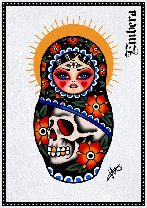 A Russian nesting doll (matryoshka)-styled illustration titled "Embera" by the artist "HM" features a striking duality: the upper half depicts a traditional feminine face with blue eyes and floral headpiece, while the lower half reveals a skull surrounded by orange flowers, all set against a golden sunburst halo. The artwork perfectly complements the "Friday witches" post, embodying the magical weekend spell with its blend of beauty, mortality, and mystical folklore aesthetic.