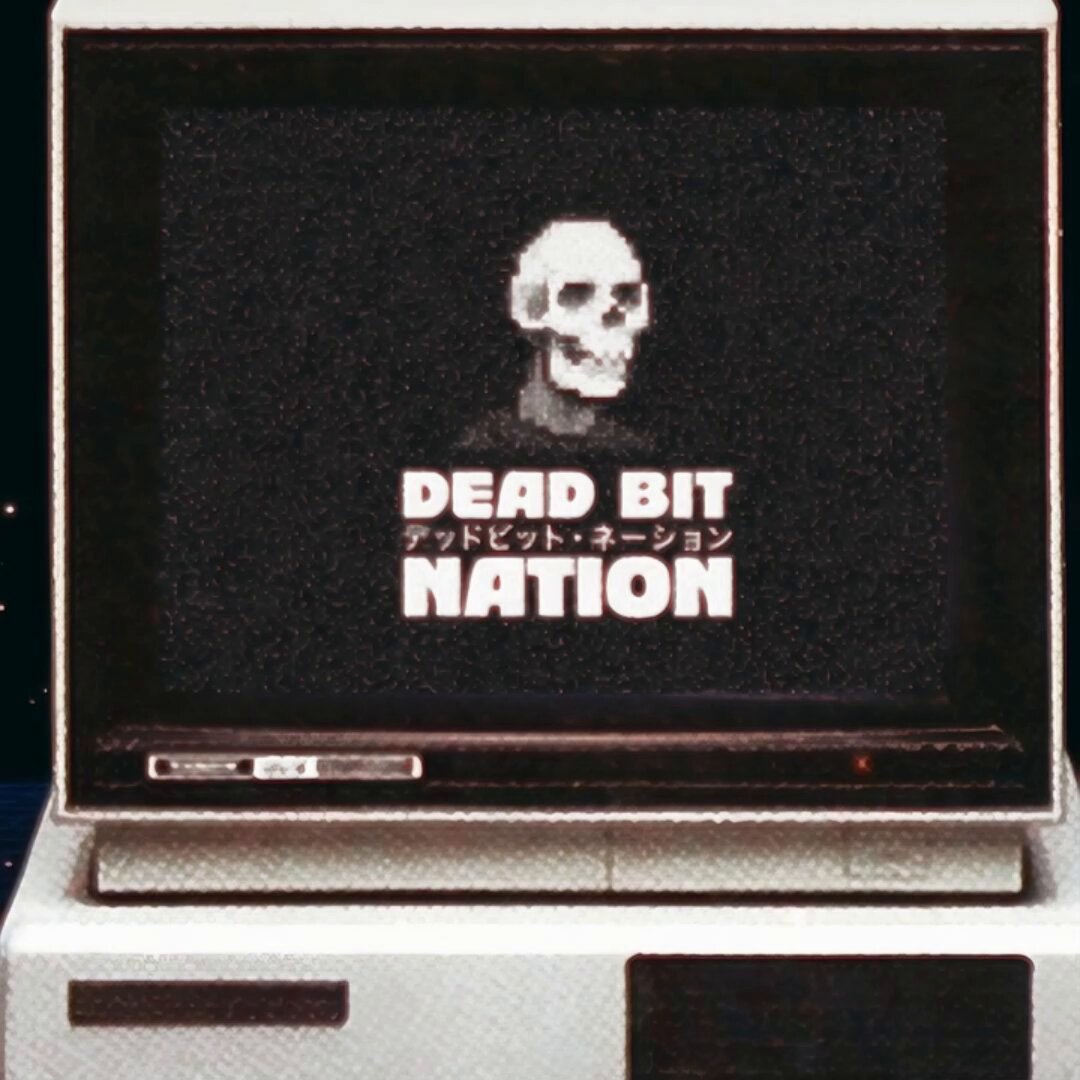 The image features a computer monitor with the words "Dead Bits Nation" written across its screen, along with an illustration of a skull. The monitor appears to be turned off or muted, suggesting that the viewer might not have noticed this detail at first glance. The text on the monitor reads "Dead bits: The Reanimation Dead pixels become live agents on Ethereum Soon", which is related to the post about Ethereum and the reanimation of dead pixels into living agents.

The image also contains a small portion of a computer tower, possibly indicating that this scene takes place in an office or workspace setting where the monitor was placed on top of it.