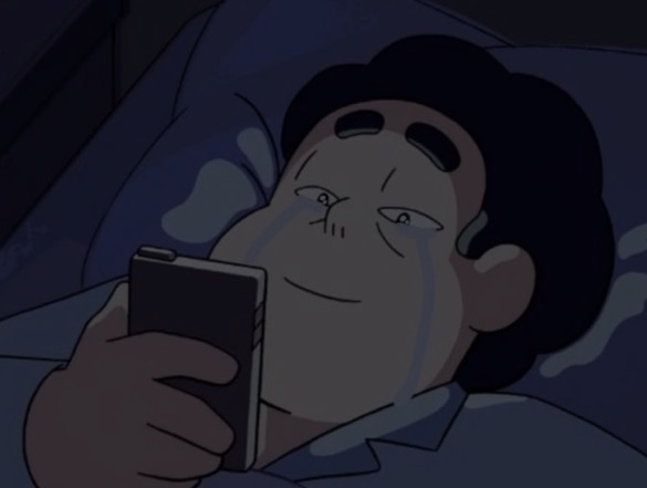 A cartoon character laying down with a cellphone, possibly viewing old screenshots or analyzing them for future use.
