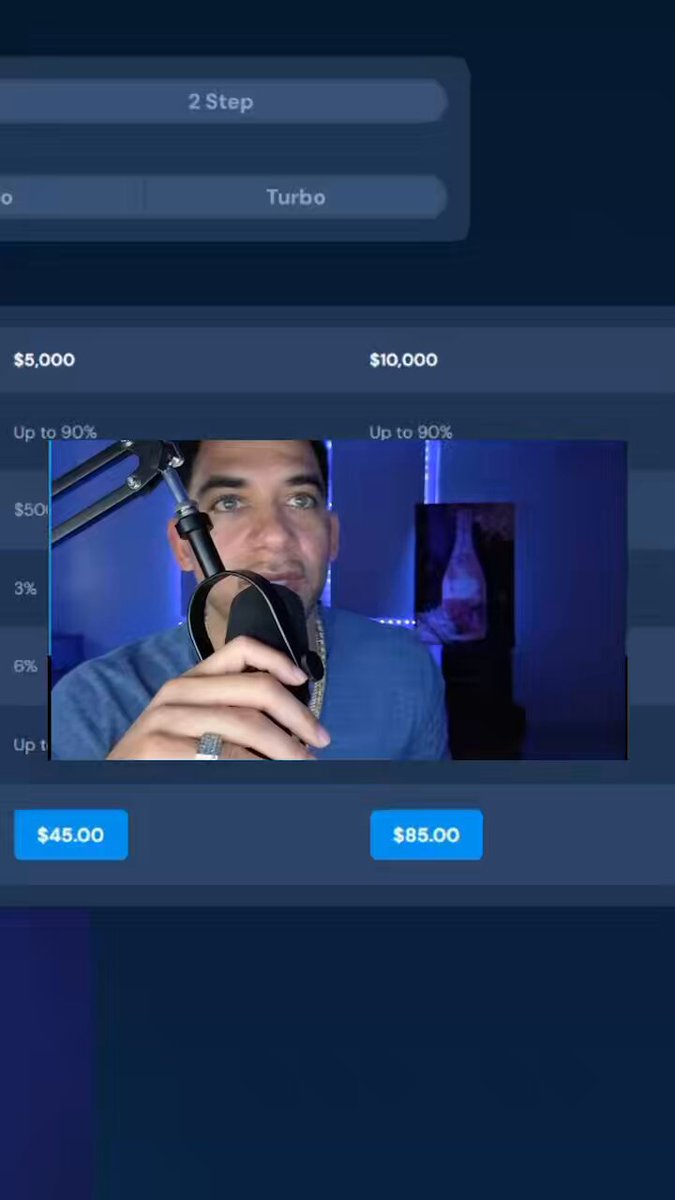 The image shows a man holding a microphone up, possibly for recording purposes or live streaming an event. The backdrop features a blue background with various icons related to finance and tech industries, such as Bitcoin, Ethereum, XRP, and others. The caption explains that the video is a promotional advertisement or demonstration of how Breakout prop works using different cryptocurrencies like Bitcoin and Ripple, among other virtual currencies.