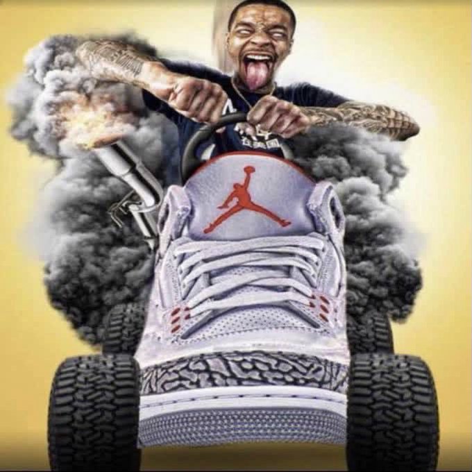 A meme image of NBA player Damian Lillard driving a shoe-shaped vehicle (a Jordan sneaker on wheels) through smoke with his tongue out.