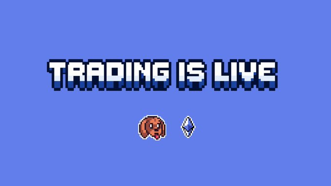 Pixel art image with a blue background displaying the text "TRADING IS LIVE" alongside a pixelated hotdog icon next to a blue diamond, promoting the live trading status of a HotDogs NFT collection.