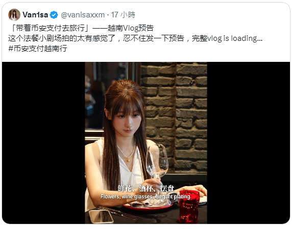A tweet from Vanisa (@vanisaxxm) promoting a Vietnam Vlog featuring a woman holding a wine glass at a restaurant, with text about 'Flowers, wine glasses, elegant plating'.
