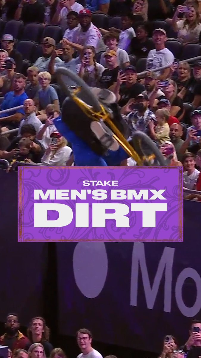 A BMX rider performs an inverted aerial trick mid-flight above a packed stadium crowd, with an overlay graphic reading "STAKE MEN'S BMX DIRT" displayed prominently. The image captures the thrilling action of the Men's BMX Dirt competition referenced in the post, highlighting the athleticism of the event held at the MoonPay X Games League Championship in NOLA.