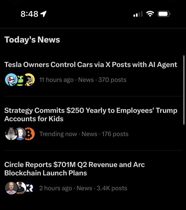 Mobile app news feed displaying headlines including 'Tesla Owners Control Cars via X Posts with AI Agent', 'Strategy Commits $250 Yearly to Employees' Trump Accounts for Kids', and 'Circle Reports $701M Q2 Revenue and Arc Blockchain Launch Plans'.