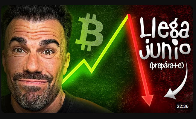 The image features a man with a beard wearing a black shirt who appears to be making a funny face or showing an expression of surprise. The background of the image has a green color, which contrasts with the red arrow pointing downwards. The text "LLEGA JUNIO" is written in white letters above the man's head and "preparete" below his feet. This suggests that there might be some sort of financial or economic event happening, possibly related to Bitcoin, causing an impending crash.