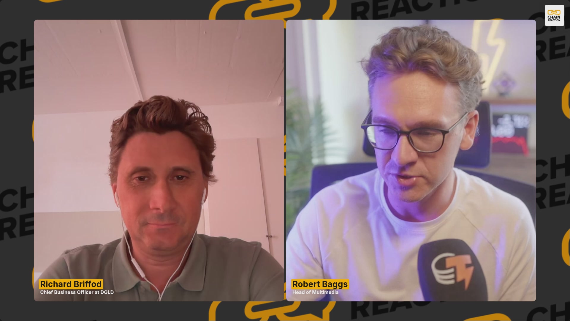 The image shows two men sitting next to each other with their faces displayed on a computer screen. The man on the left has brown hair, while the man on the right has blonde hair. They are both wearing glasses. The background of the image is black with yellow text that reads "Reach out to us".