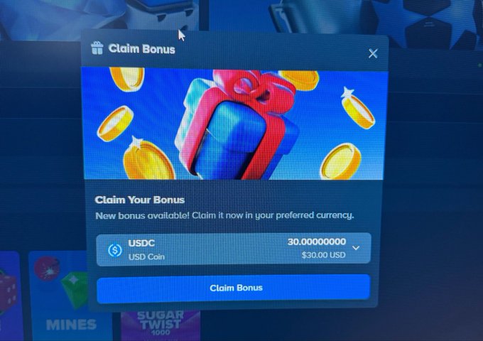 A "Claim Bonus" pop-up window on the Stake platform displays an offer for new users, showing a balance of 30 USDC ($30.00 USD) that can be claimed by clicking the "Claim Bonus" button, illustrating the type of rewards mentioned in the accompanying post about bi-weekly bonuses and wager target tasks.