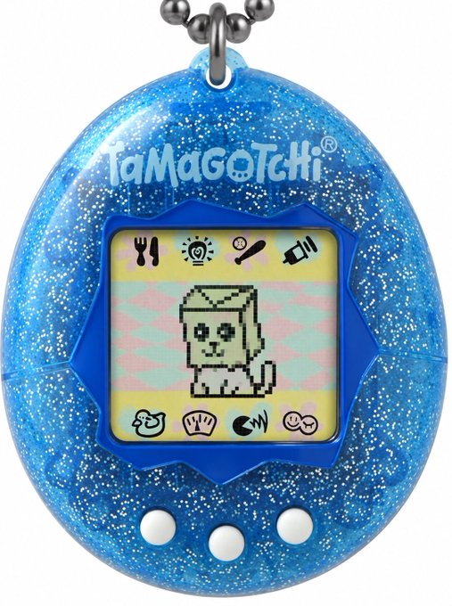 A blue glittery Tamagotchi virtual pet device displaying a pixelated figure on its screen, with the 'TaMaGoTcHi®' logo at the top.