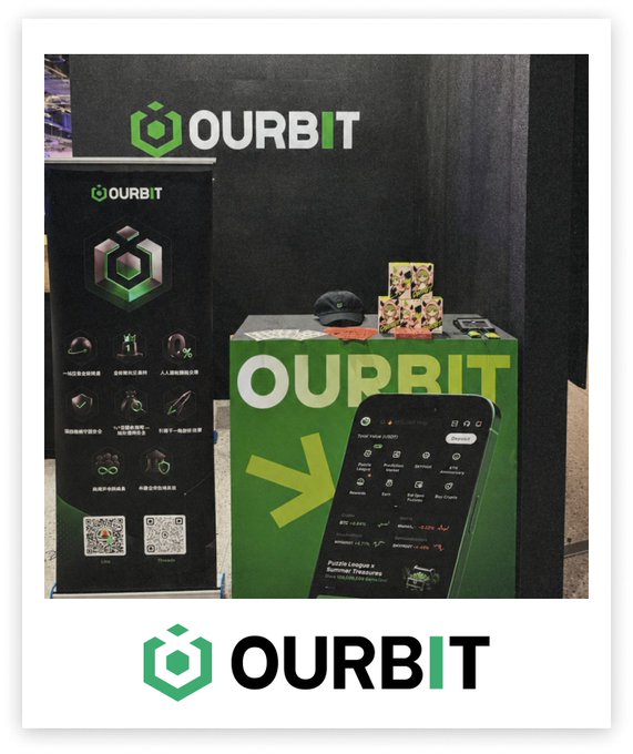 OURBIT's trade show booth, featuring green branding and a promotional display with a smartphone mockup and feature highlights, is set up at what appears to be G1 Taipei Week in Taiwan. The post celebrates the exchange's presence at the event and invites attendees to visit the booth.