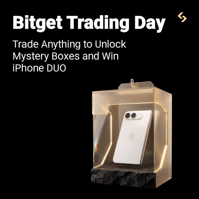 Promotional graphic for “Bitget Trading Day” featuring the text “Trade Anything to Unlock Mystery Boxes and Win iPhone DUO.” A gold-accented mystery box containing a white iPhone is displayed, matching the post’s offer of trading for mystery boxes and prizes such as iPhones, USDT, BTC/ETH, XAUT, and position coupons.