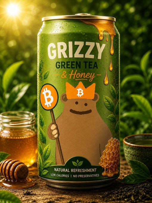 A green beverage can labeled 'GRIZZY GREEN TEA & Honey' featuring a bear mascot wearing a Bitcoin crown, surrounded by a honey jar, honeycomb, and a tea cup on a nature-themed background. The can also notes 'NATURAL REFRESHMENT, LOW CALORIES | NO PRESERVATIVES.'