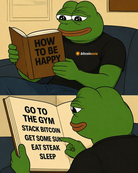 A meme featuring a green frog character in two panels: the top shows the frog reading a book titled 'HOW TO BE HAPPY' while wearing a 'bitcoin asia' shirt, and the bottom reveals the book's contents: 'GO TO THE GYM, STACK BITCOIN, GET SOME SUN, EAT STEAK, SLEEP.'