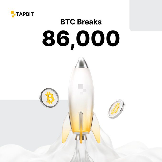 A promotional graphic by TAPBIT announcing 'BTC Breaks 86,000' featuring a rocket ship launching with Bitcoin coins around it.