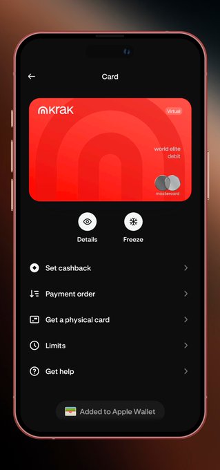 A smartphone displaying the 'Krak' app showing a red virtual Visa debit card labeled 'world elite debit' by Mastercard, with menu options including Details, Freeze, Get cashback, Payment order, Get a physical card, Limits, Get help, and 'Added to Apple Wallet'.