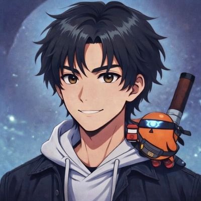 The image features a young man with dark hair wearing a hoodie, holding an orange object that appears to be a toy or a small figurine. The background of the image is blue, which contrasts with the boy's dark hair color. There are no texts present in the image.