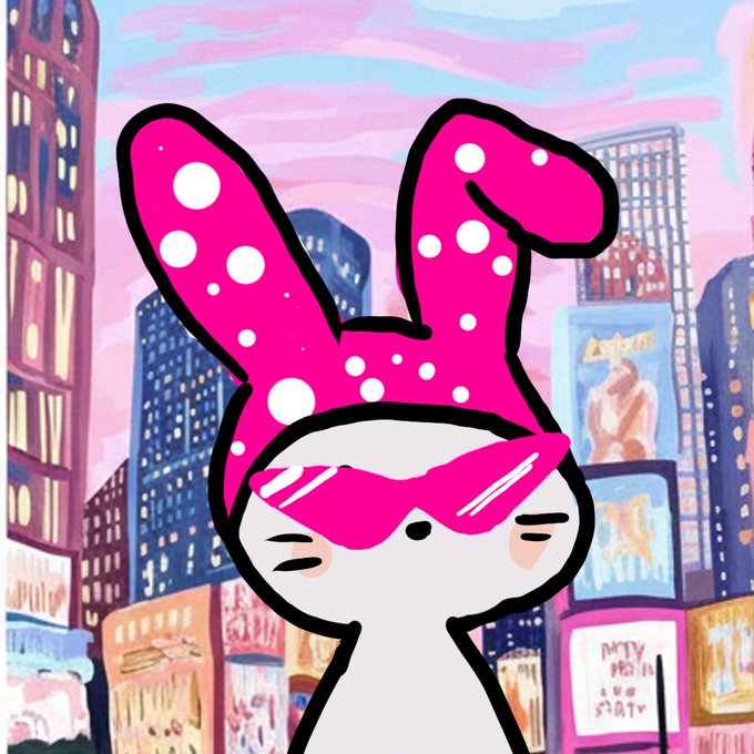 An illustration of a cute white cat wearing a large pink polka-dot bunny-ear hood and pink sunglasses, set against a vibrant, pastel-colored painted cityscape resembling Times Square.