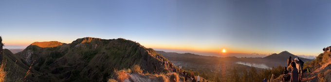 A panoramic sunrise view over misty mountain peaks with the sun rising on the horizon. The caption "I need my Sol! They took our sun away" fits the image, as the sun is just emerging over the mountain range, as if being returned or witnessed after a long absence.