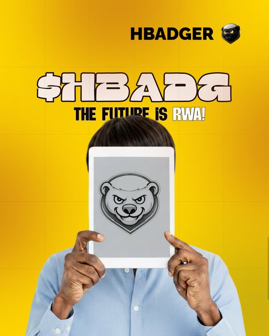 A person holds up a tablet displaying the HBADGER silver badger shield logo in front of their face, set against a yellow background with text reading 'HBADGER' and '$HBADG THE FUTURE IS RWA!'.