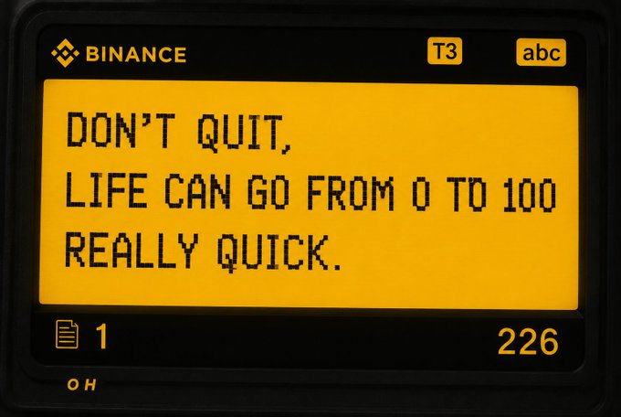 A Binance T3 abc ticker display showing the message: 'DON'T QUIT, LIFE CAN GO FROM 0 TO 100 REALLY QUICK.'